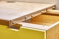 Plywood desk with multi color drawers during assembly. Close-up