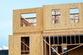 plywood walls of a new house development truss unfinished framework Royalty Free Stock Photo
