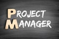 PM - Project Manager acronym, business concept on blackboard