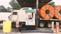 AM PM Truck stop and convenience store large orange cable spool