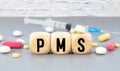 PMS Premenstrual Syndrome acronym on wooden block