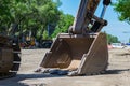 Pneumatic excavator bucket close up during road works