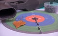 pneumatic shooting.air rifle and bullets on the background of a colored target. Royalty Free Stock Photo