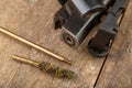 A pneumatic weapon on a wooden table on a shooting range. Shooting accessories needed for shooting sports