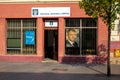 PNL Party Partidul National Liberal, National Liberal Party local office, with a picture of Klaus Werner Iohannis in window