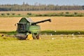 Rice harvester at work harvesting rice in the Po River Delta, Italy