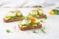 poached egg avocado toast on marble surface, microgreens sprinkle Royalty Free Stock Photo