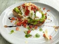 Poached egg breakfast with rye bread and avocado Royalty Free Stock Photo