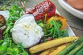 Poached egg with corn vegetables, grilled pepper, spinach, arugula, green beans and baby salad. Close up. Natural food Royalty Free Stock Photo