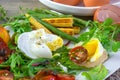 Poached egg with corn vegetables, grilled pepper, spinach, arugula, green beans and baby salad. Close up. Natural food Royalty Free Stock Photo