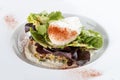 Poached egg with quinoa and salad on a white plate Royalty Free Stock Photo