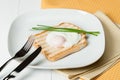 Poached Egg On Toast With Chives. White Plate Royalty Free Stock Photo