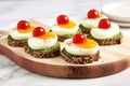 poached eggs on avocado toast with cherry tomatoes on a marble slab Royalty Free Stock Photo