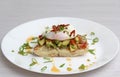 Poached eggs bacon tomatoes and avocado on toast Royalty Free Stock Photo