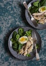 Poached mackerel, spinach and egg salad on a dark background, top view. Delicious healthy food Royalty Free Stock Photo