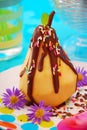 Poached pear with chocolate for child Royalty Free Stock Photo