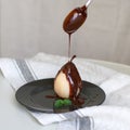 Poached pear with chocolate. Royalty Free Stock Photo