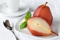 Poached pear and ice cream with red wine sauce Royalty Free Stock Photo