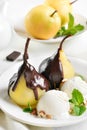 Poached pears with chocolate sauce and ice cream Royalty Free Stock Photo