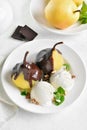 Poached pears with chocolate sauce and ice cream Royalty Free Stock Photo