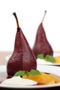 Poached pears with creme fraiche and oranges Royalty Free Stock Photo