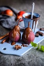 Poached pears in red wine and topped with chocolate sauce Royalty Free Stock Photo