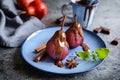 Poached pears in red wine and topped with chocolate sauce Royalty Free Stock Photo