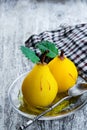 Poached pears with spices in a serving dish on wooden table Royalty Free Stock Photo