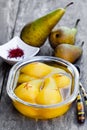 Poached pears with spices in syrup on the glass bowl Royalty Free Stock Photo