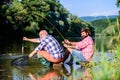 Poaching crime and fishing license. Black market caviar. Poachers fishing. Trap for fish. Men sit at riverside with Royalty Free Stock Photo