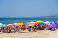 Tourists on Monte Gordo beach, Vila Real de Santo Antonio, Portugal.