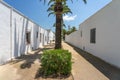 Street of the fishers village of Poble Nou del Delta with its typical white houses.