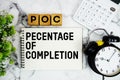 POC Pecentage Of Completion text with calculator and alarm clock on marble background Royalty Free Stock Photo