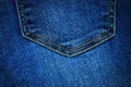 Pocket on a blue cotton background. Jeans Royalty Free Stock Photo