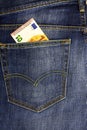 In the pocket of dark jeans inserted banknote 10 euro Royalty Free Stock Photo