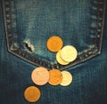 Pocket with hole and coins Royalty Free Stock Photo