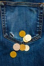 Pocket with hole and coins Royalty Free Stock Photo