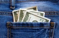 Money dollars lie in the back pocket of jeans Royalty Free Stock Photo