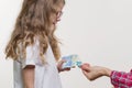 A Pocket money. Mom gives the child cash. Royalty Free Stock Photo