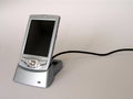 Pocket PC on docking station Royalty Free Stock Photo