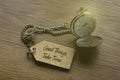 A pocket watch attached to a tag written with quotes Good Things Take Time