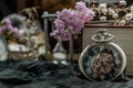 Pocket watch, blur stack of old book, hourglass, vintage binocular and world desk globe on dark background Royalty Free Stock Photo