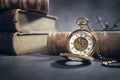 Pocket watch and books in library or study Royalty Free Stock Photo