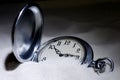 Pocket watch covered with sand Royalty Free Stock Photo