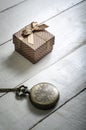 Pocket watch with gift box on wooden background. Royalty Free Stock Photo