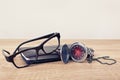 Pocket watch, glasses and a planner on a table Royalty Free Stock Photo