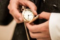 Pocket watch in hands holding old clock Royalty Free Stock Photo