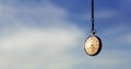 Pocket watch hanging from sky Royalty Free Stock Photo