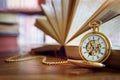 Pocket watch in library or study Royalty Free Stock Photo