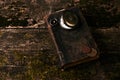 Pocket watch with old antique bible book and retro coins